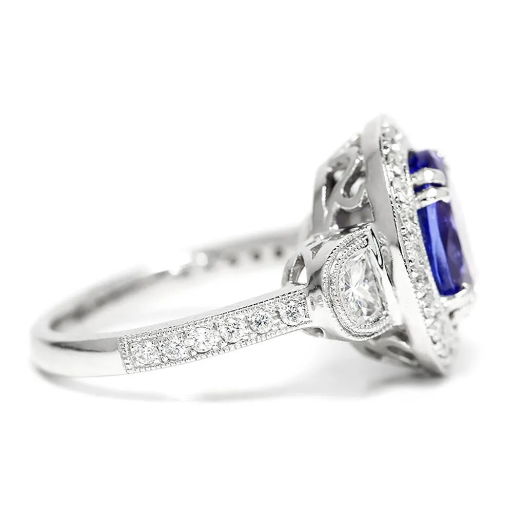 Oval Tanzanite Halo Ring with Half Moon Diamond’s 18K