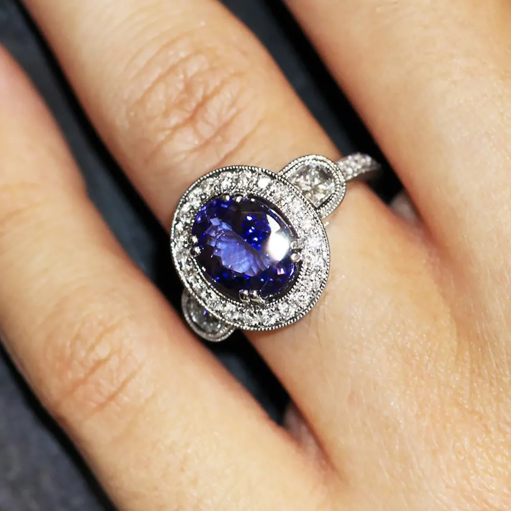 Oval Tanzanite Halo Ring with Half Moon Diamond’s 18K