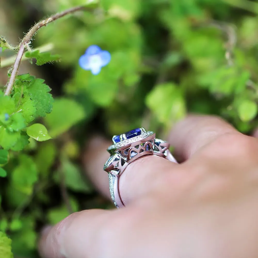 Oval Tanzanite Halo Ring with Half Moon Diamond’s 18K