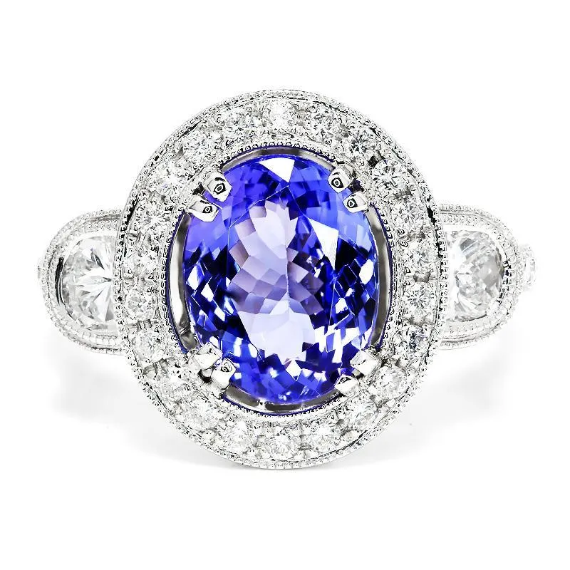 Oval Tanzanite Halo Ring with Half Moon Diamond’s 18K