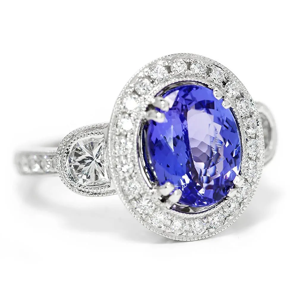 Oval Tanzanite Halo Ring with Half Moon Diamond’s 18K