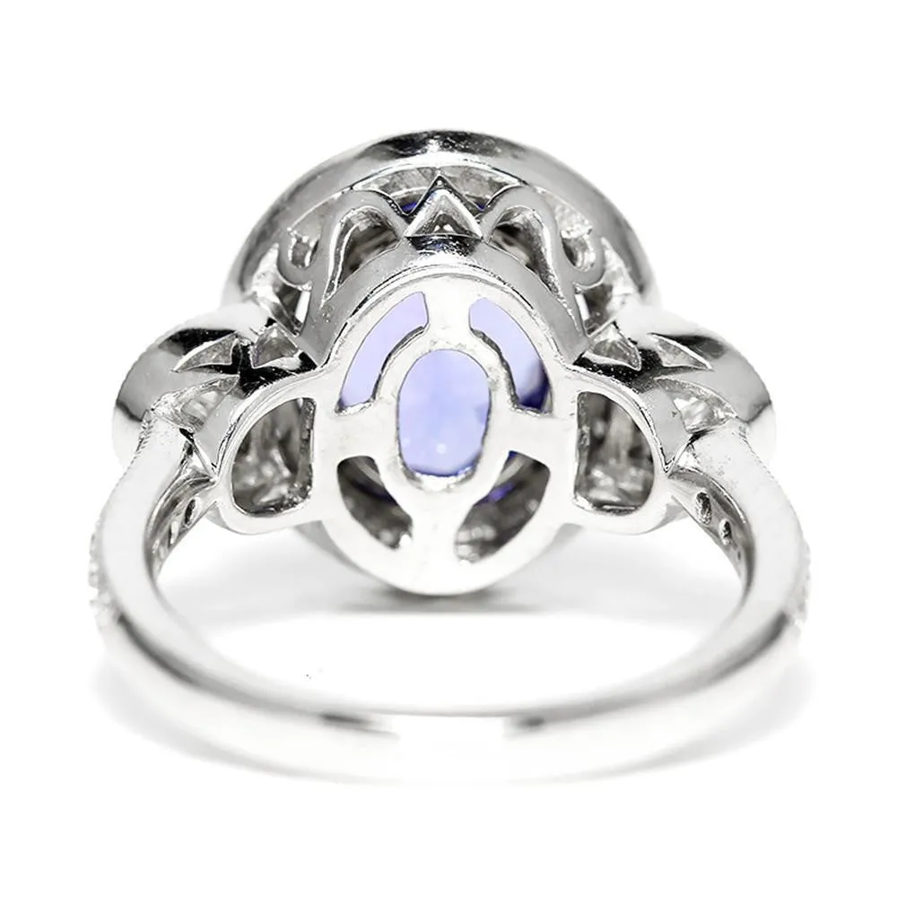 Oval Tanzanite Halo Ring with Half Moon Diamond’s 18K